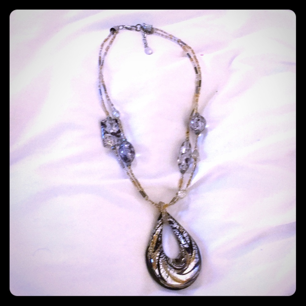 Glass necklace with silver and gold inside